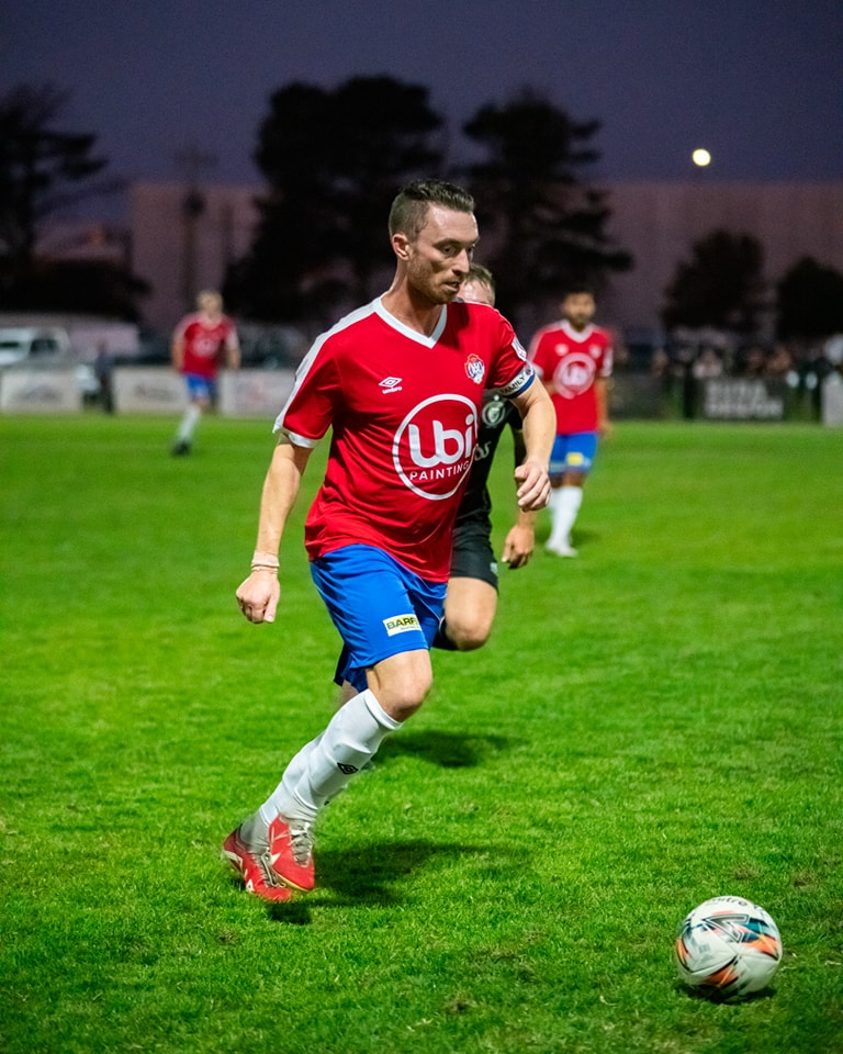 football player with custom captain armband. Made to suit this NLP teams history and culture.
