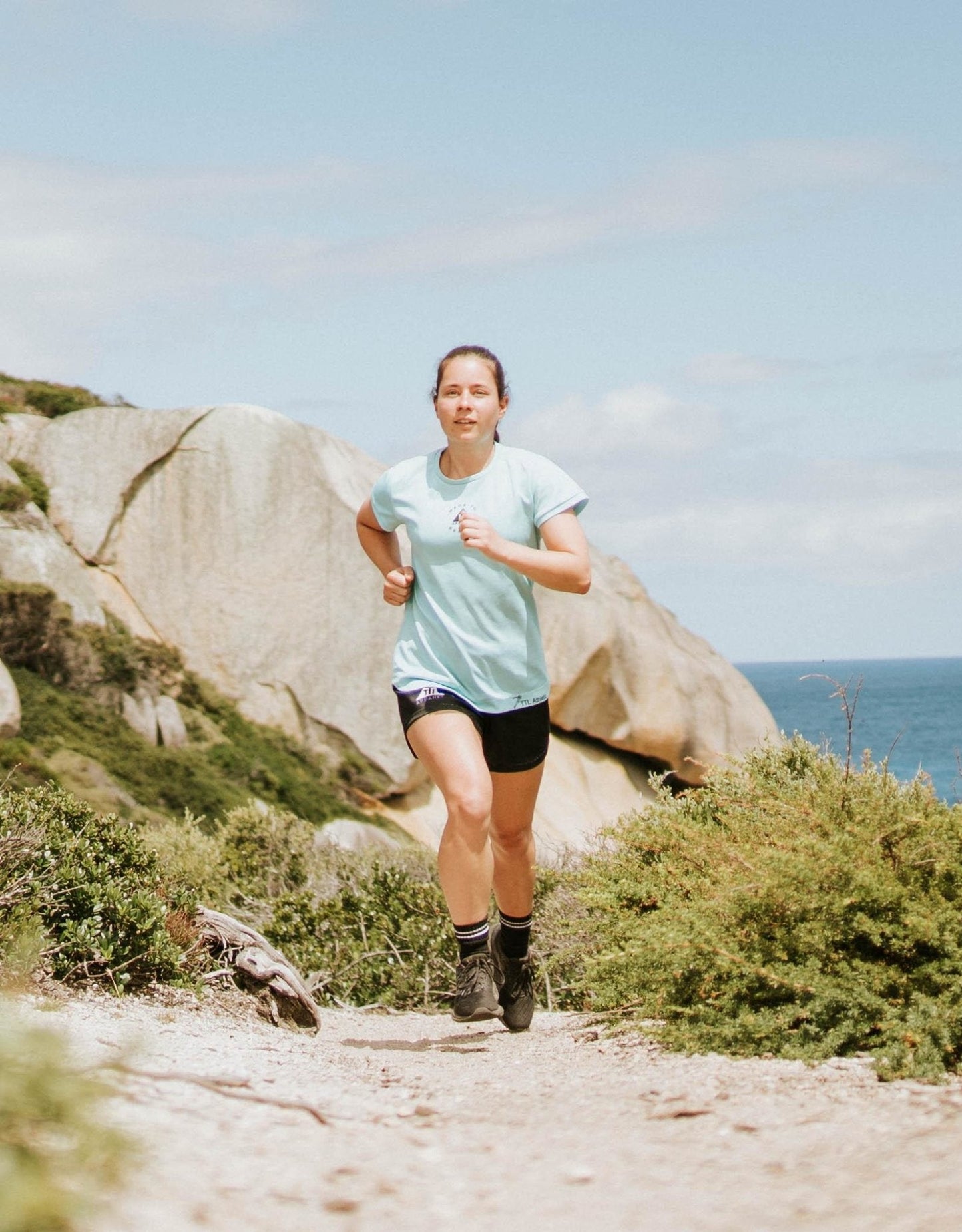 Women's running top made for trails and the outdoors. Made from recycled material. Made in Australia.
