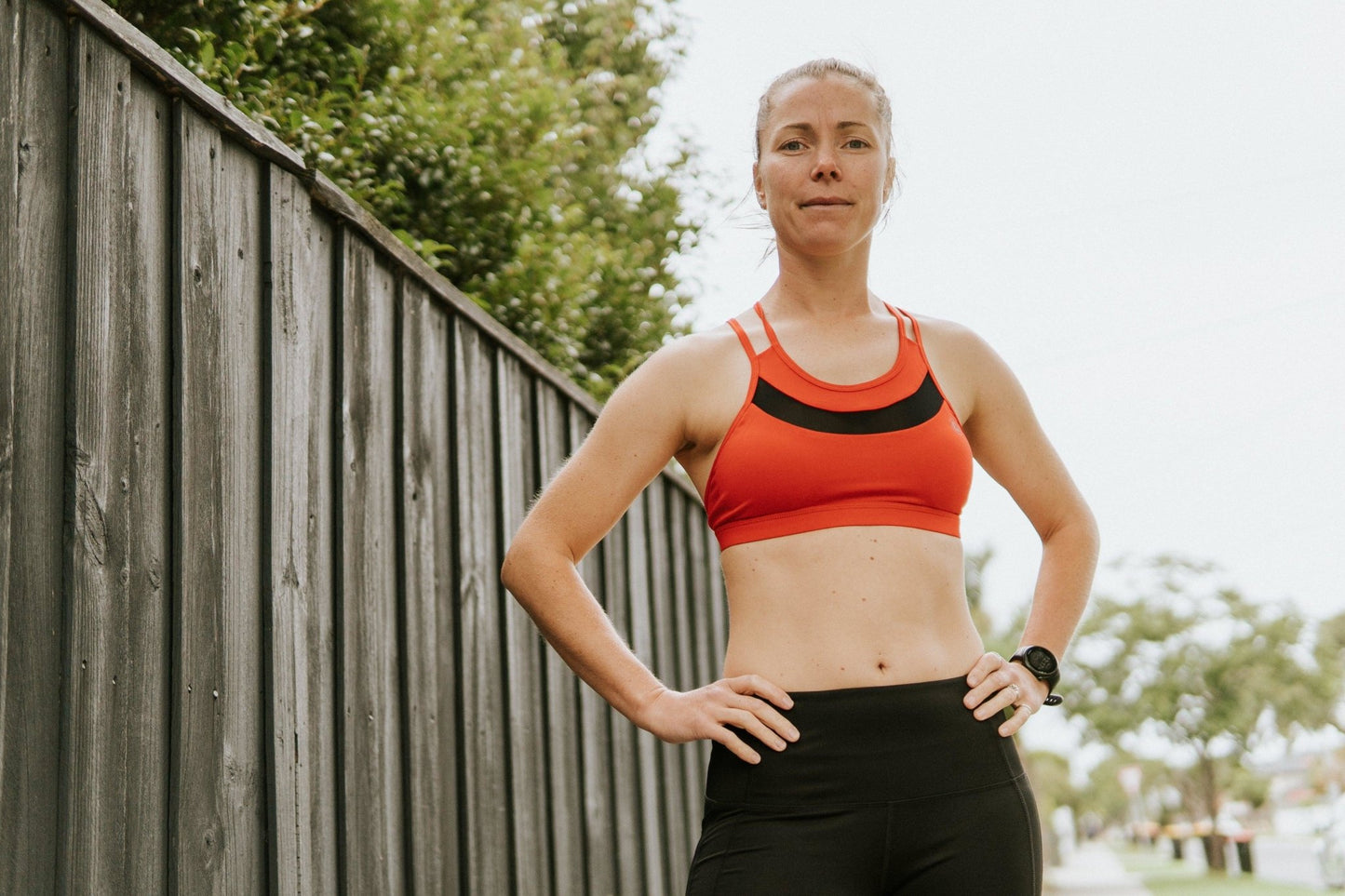 Medium support sports bra in red with breathable mesh.