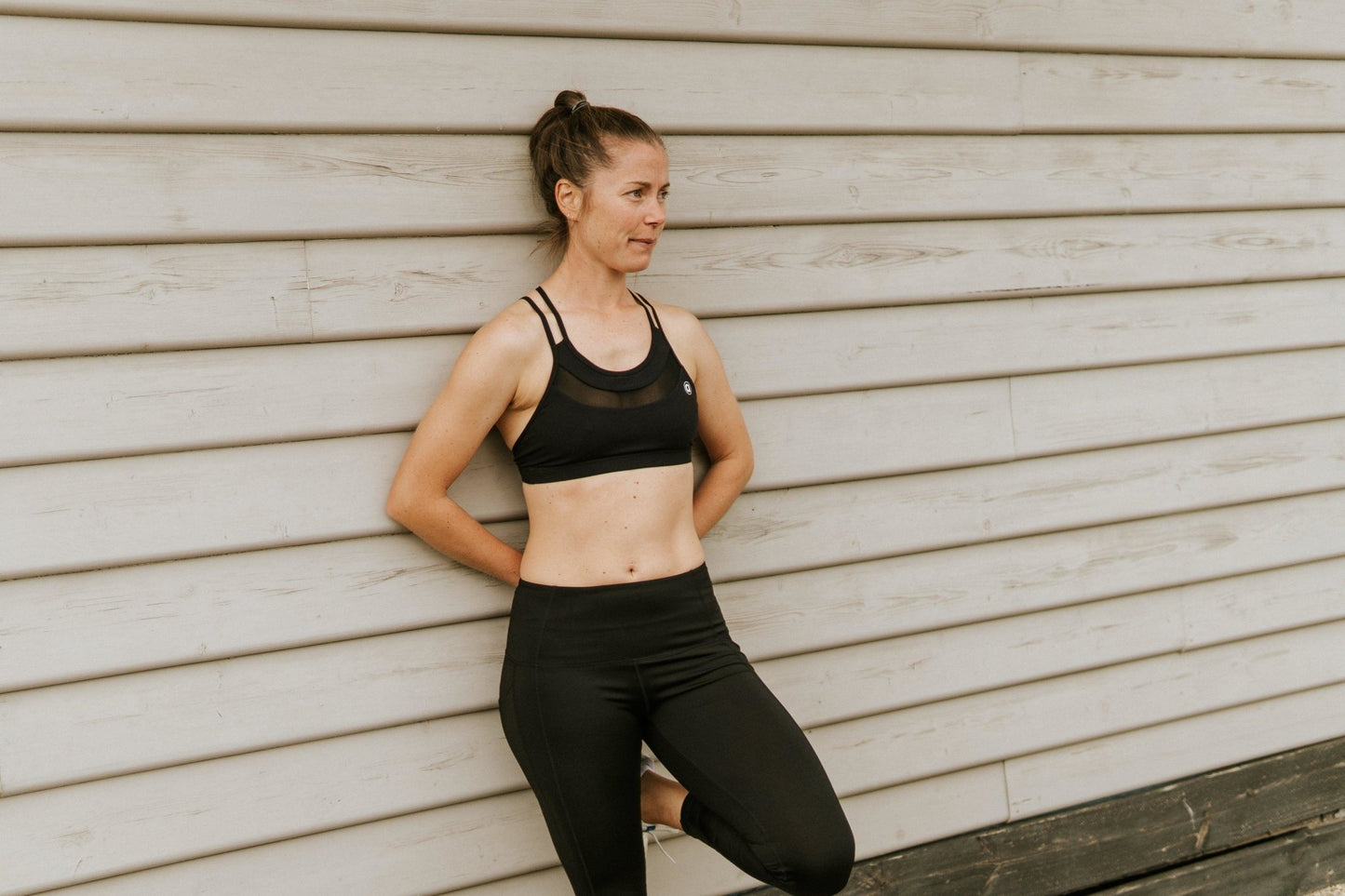 Medium support sports bra in black with breathable mesh.