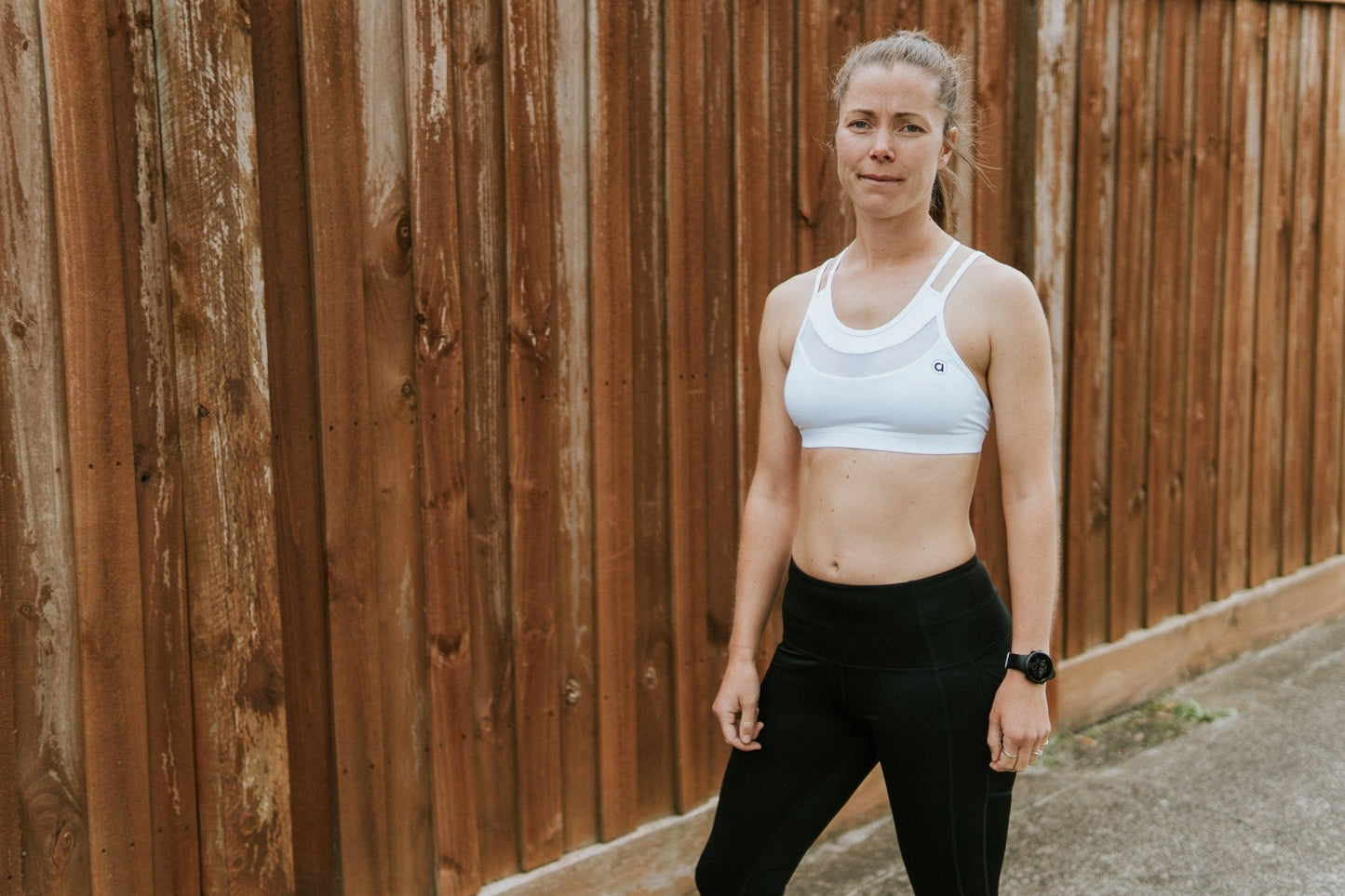 Medium support sports bra in white with breathable mesh.