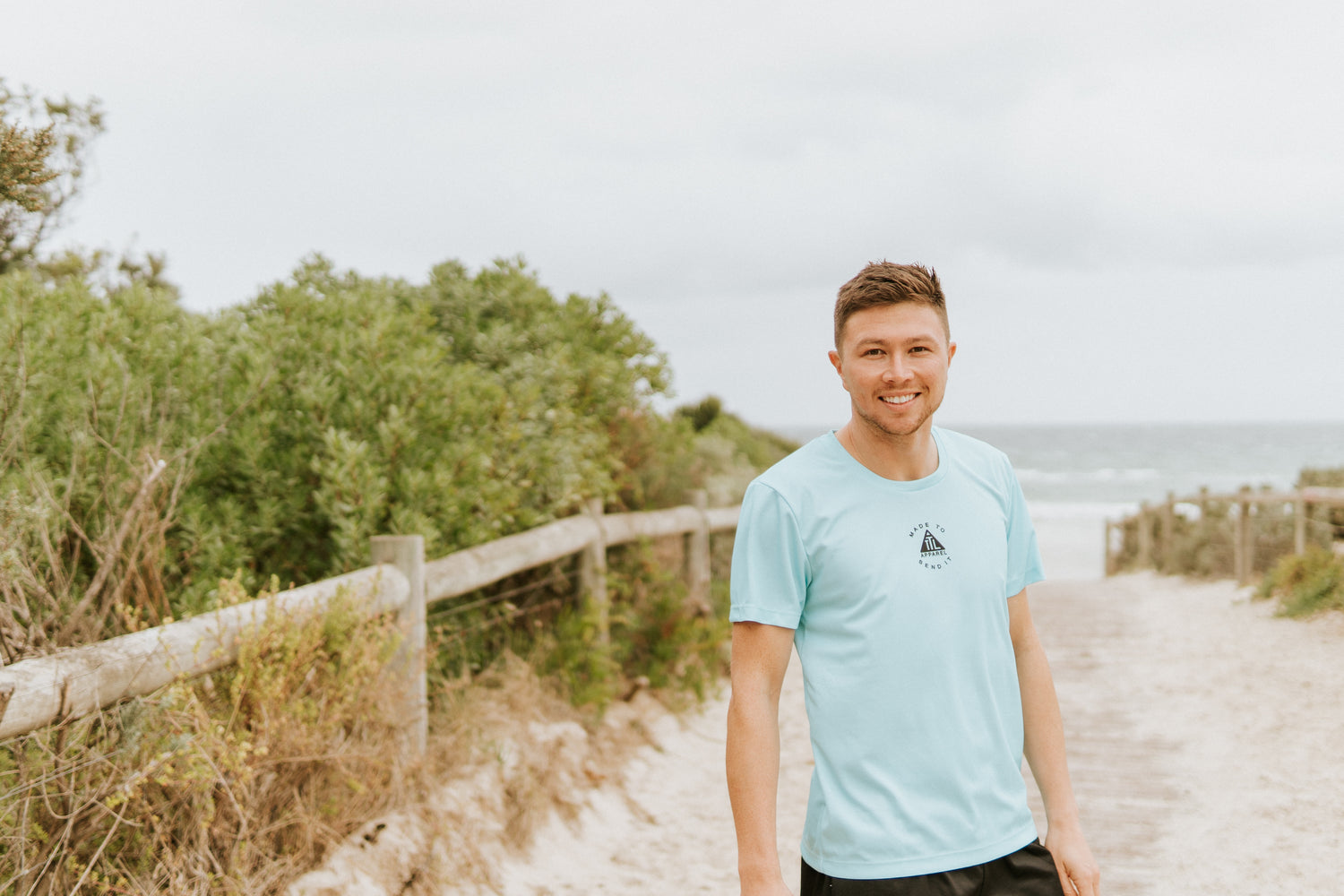 Mens running shirt in Teal. Made in Australia from recycled material.