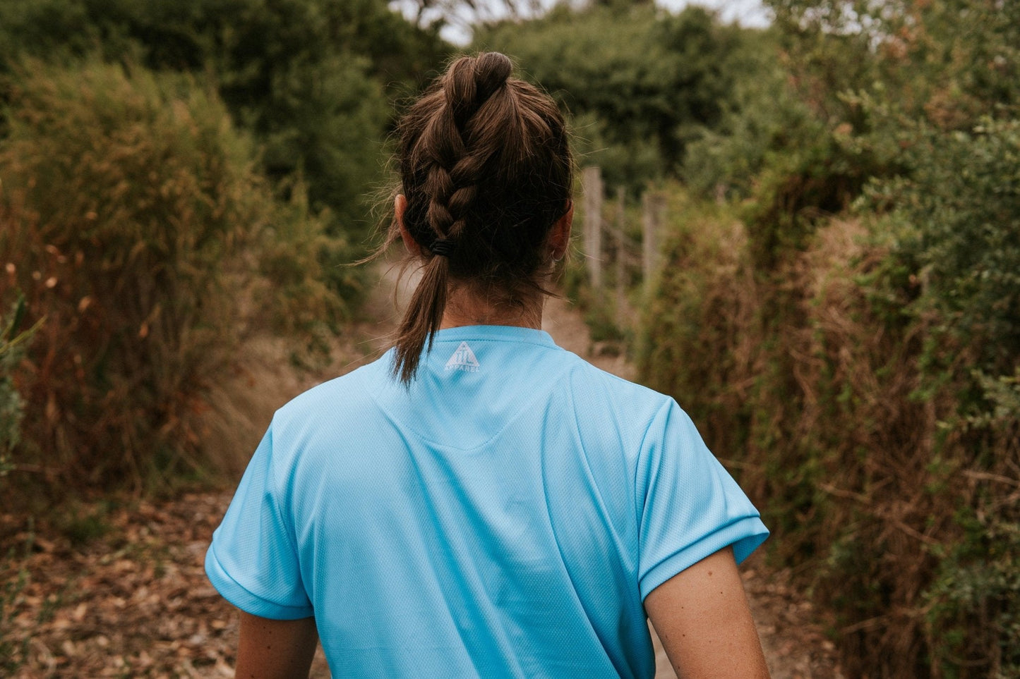 Women's running top in sky blue with moisture wicking technology made from recycled material. This is a loose fit shirt designed for extra room.