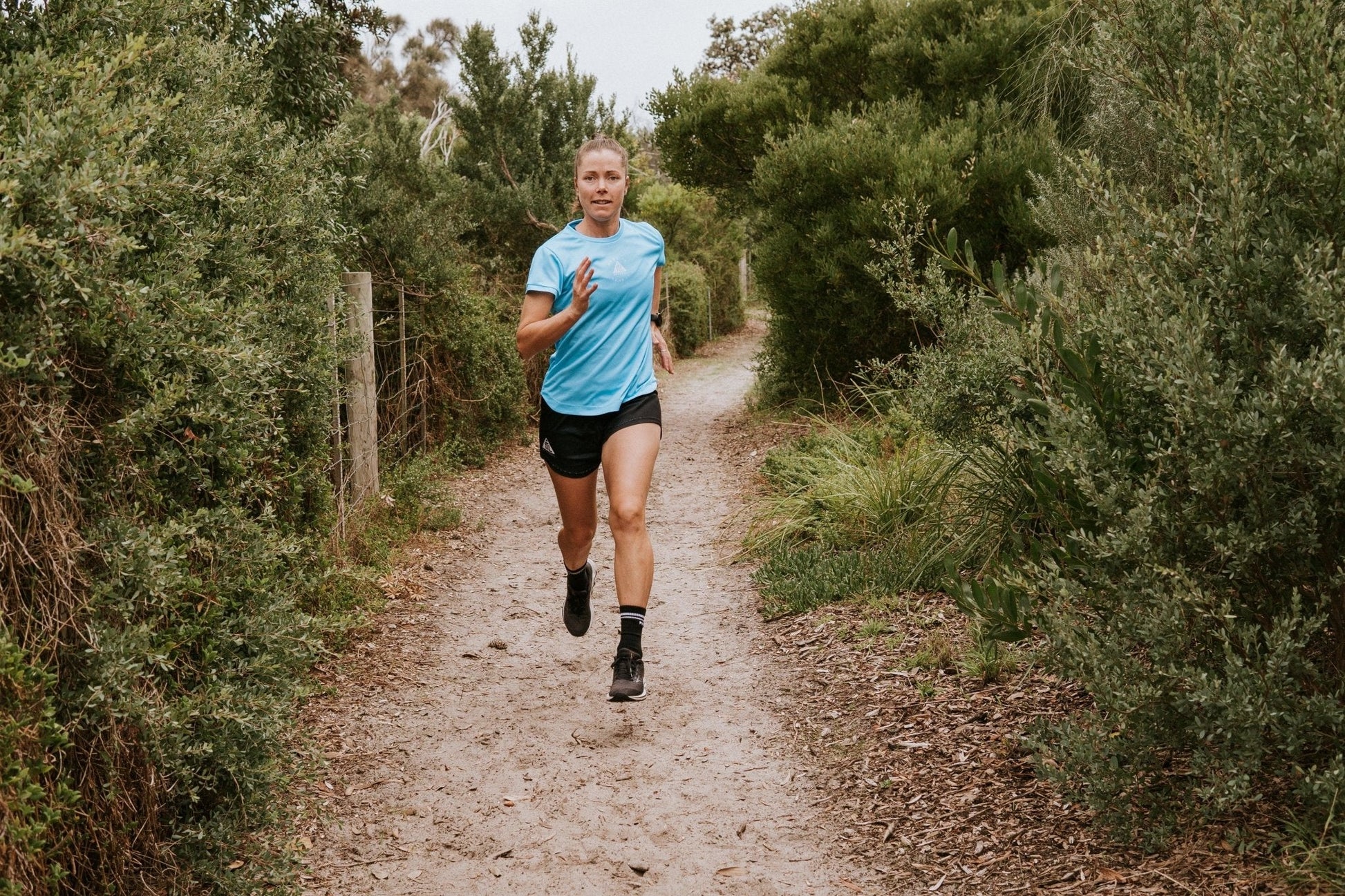 Women's running top in sky blue with moisture wicking technology made from recycled material. This is a loose fit top designed for extra room. Shirt is made in Australia.