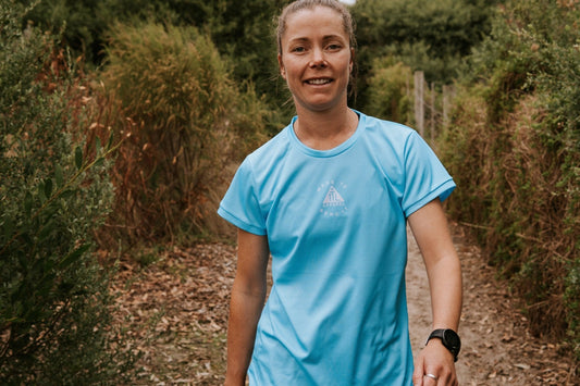 Women's running top in blue with moisture wicking technology made from recycled material. This is a loose fit top designed for extra room. Shirt is dade in Australia.  