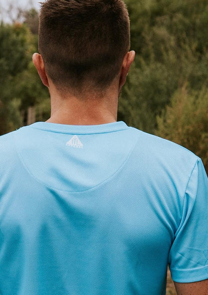 Sky blue running and training top. Back view with TTL logo. Made from recycled material. Made in Australia. 