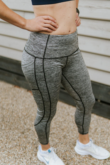 Grey mid rise 7/8 compression leggings in grey. Our compression legging include a handy pocket for you mobile phone.