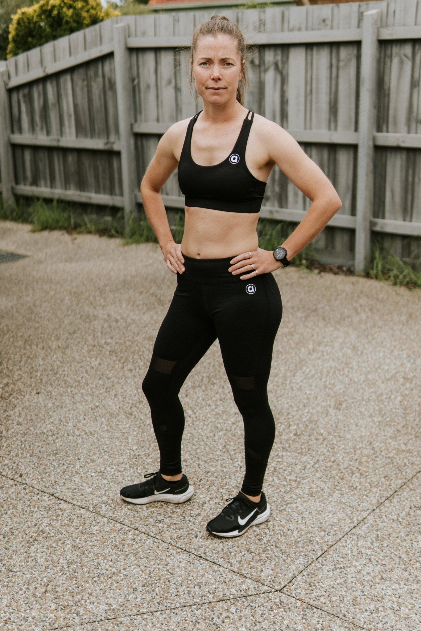 Mid rise full length compression leggings in black.