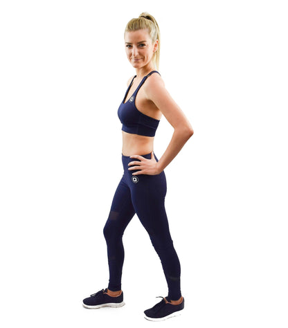 Mid rise full length compression leggings in dark blue.